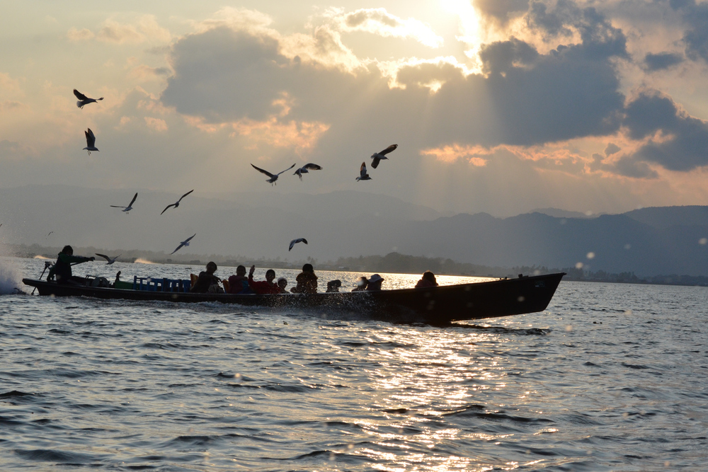 Boat with tourists on the way back to Nyaung Shwe from a visit to Inle lake.
