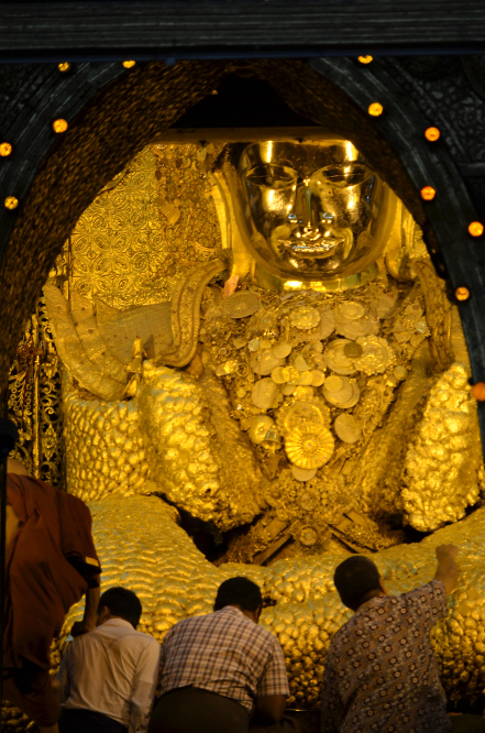 A several cm thick layer of gold leaf covers the Buddha